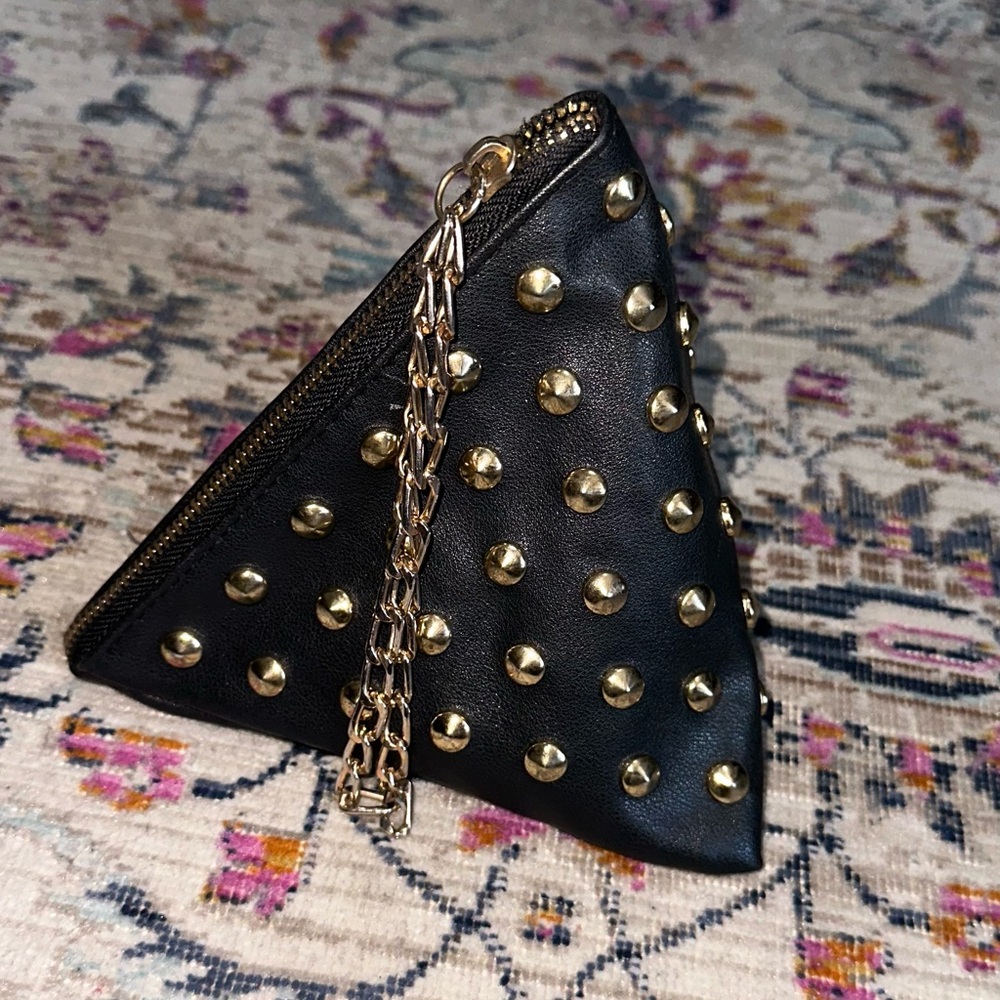 Triangle clutch wristlet with golden accents